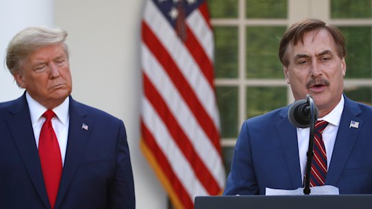 My Pillow chief executive Mike Lindell speaks as President Donald Trump listens during a briefing about the coronavirus at the White House last March.