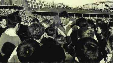 Provan stands among St George fans after the 1965 grand final win at the SCG.