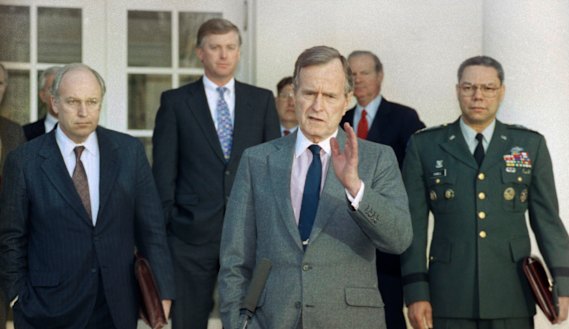 President George H.W. Bush talks to reporters in the Rose Garden of the White House in 1991. He is surrounded by then (from left) defence secretary Dick Cheney, vice-president Dan Quayle, White House chief of staff John Sununu, secretary of sState James Baker, and joint chiefs chairman General Colin Powell. 