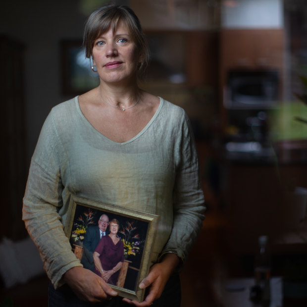 Shelley Anson took part in a washing and dressing ritual when her mother Lorraine died. Here, she holds a frame photo of her parents.