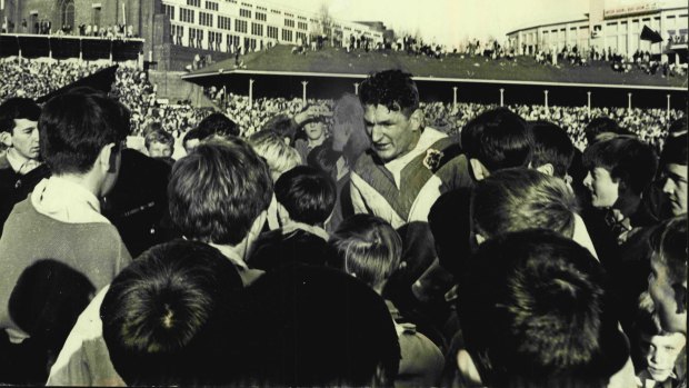 Provan stands among St George fans after the 1965 grand final win at the SCG.
