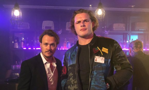 Getting in on the act: George Burgess (right) on the set of the Australian action movie Locusts with star Ben Geurens.
