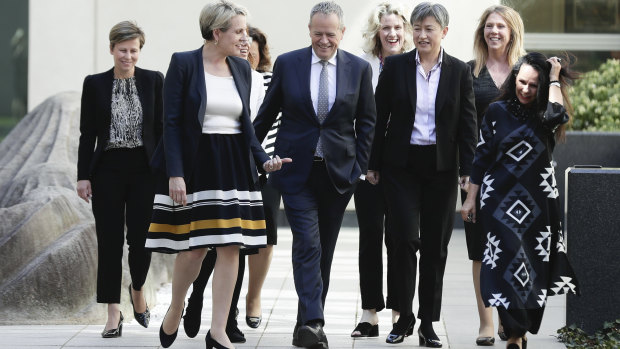 Labor leader Bill Shorten surrounded by female members of his frontbench on Tuesday. 