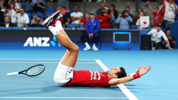 Novak Djokovic celebrates Serbia's victory in the ATP Cup on Sunday night.