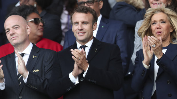 The popularity of French President Emmanuel Macron (centre), pictured watching the World Cup, is a critical threat to the Republicans. 