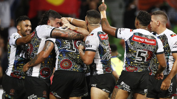 Exodus? Indigenous players celebrate a try in a match that failed to attract many viewers.