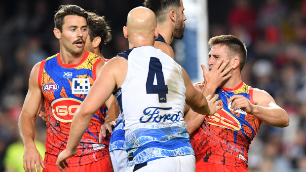 Gary Ablett clashes with Gold Coast's Anthony Miles on the weekend.