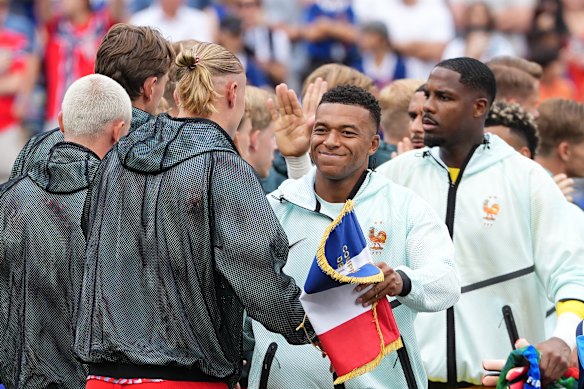 France’s Kylian Mbappe and Norway’s Erling Haaland, left, greet each other before the match.