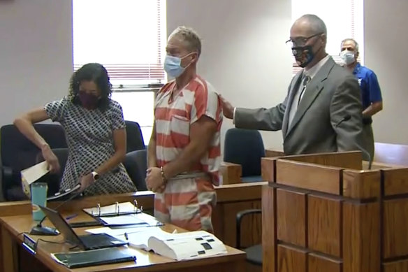 In this still image from video, Barry Morphew, centre, appears in court in Salida, Colorado earlier this month in connection with the disappearance of his wife, Suzanne.