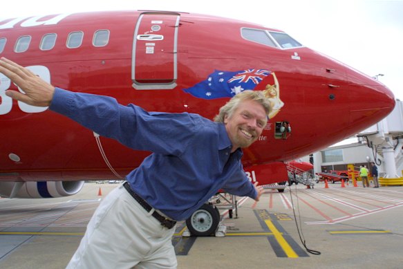 Richard Branson promoting the airline in 2002. What name did Virgin Australia originally go by?