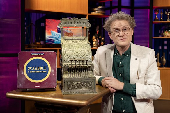John Safran poses with his prized objects on Shaun Micallef’s Eve of Destruction.
