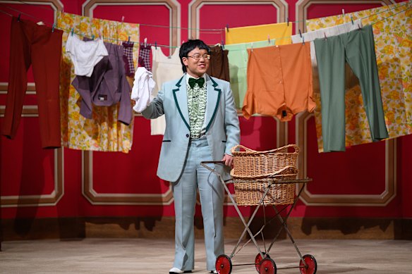 Aaron Chen appears in his trademark mint green suit and ruffled shirt.