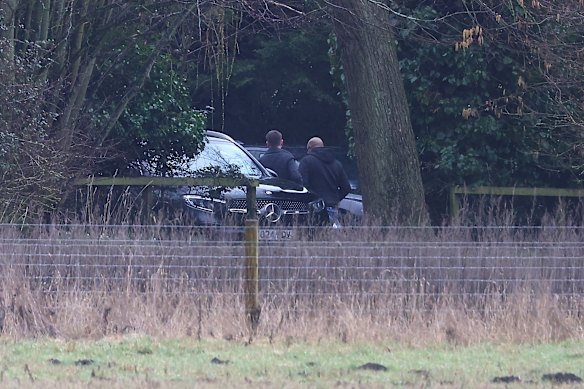 Men get out of an unmarked car at the home of Andrew Mountbatten-Windsor in Sandringham, Norfolk, on February 19, 2026.