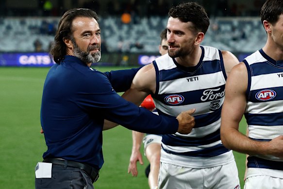Chris Scott congratulates milestone man Mark O’Connor after his 150th AFL game.