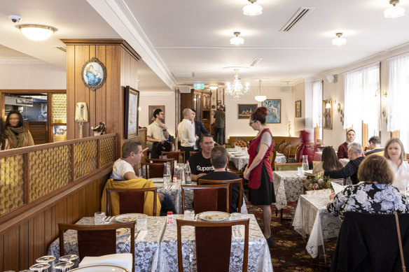 Dining tables are covered with lace, then plastic, and the waiters display Italian sass.