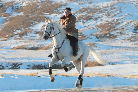 The North Korean government released this photo of Kim Jong-un riding a white horse to climb Mount Paektu.