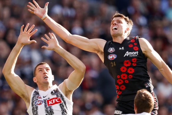 Collingwood’s Darcy Cameron and Essendon’s Jordan Ridley in this year’s Anzac Day clash.