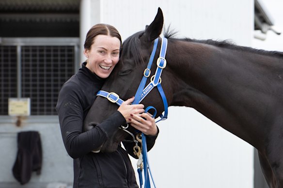 Katherine Coleman gives I Wish I Win a hug at his Pakenham home on Monday.