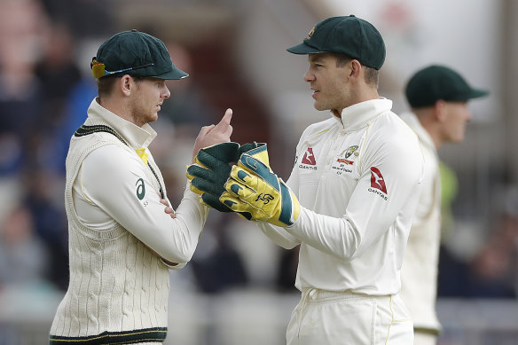 Steve Smith, left, speaks with Tim Paine, right, at the fourth Test against England in September. 