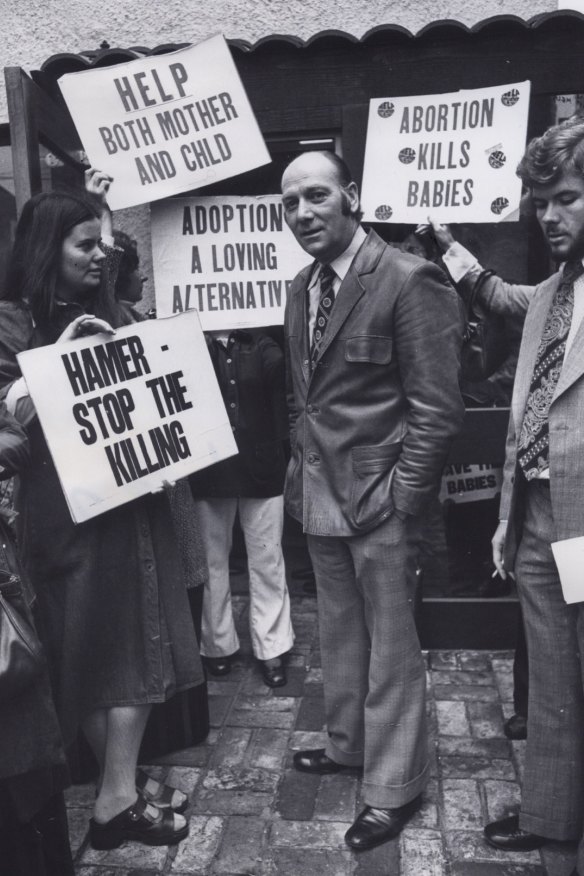 Abortion law reform campaigner Dr Bertram Wainer, surrounded by protesters outside his East Melbourne Fertility Control Clinic in 1976.