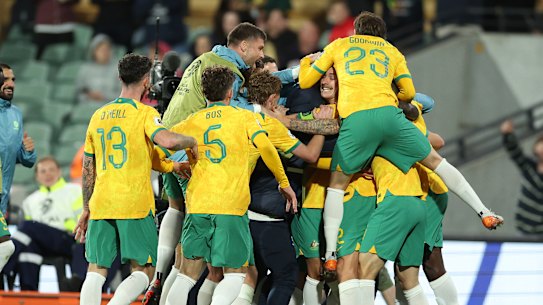 Socceroos celebrate.