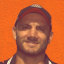 Robbie Farah and the mural dedicated to him at the Sackville Hotel in Rozelle.