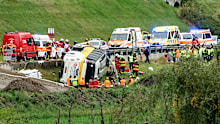 Emergency personnel respond to an accident involving a tour bus near Susch, in the canton of Grisons, Switzerland, on Thursday, Sept. 10, 2026