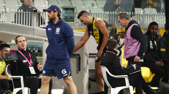 Shane Edwards leaves the field injured in the loss to Geelong.