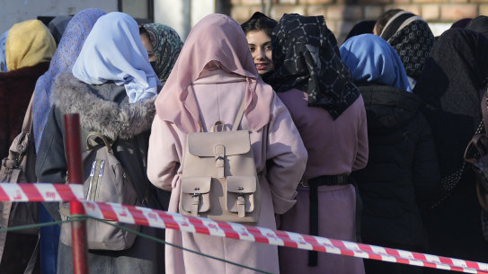 Afghan students queue outside Kabul University earlier this year. 