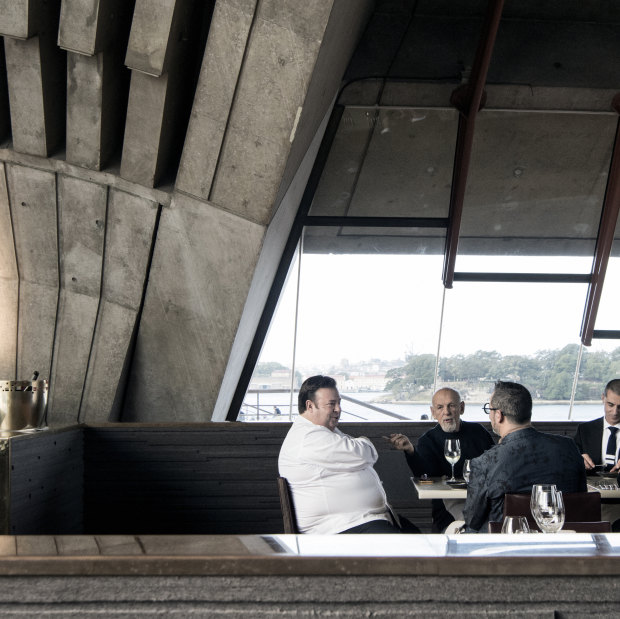 Fink Group owner Leon Fink (second from left) tastes Quay’s new menu with a group including its executive chef Peter Gilmore (left) at sister venue, the Opera House’s Bennelong.