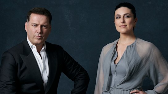 Stefanovic wears a Giorgio Armani jacket and shirt, and Okanui shorts. Abo wears a Giorgio Armani dress and Jimmy Choo shoes.