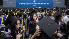 No masks required: graduates attend a ceremony at Central China Normal University in Wuhan. With no recorded cases of community transmissions since May 2020, life for residents their and many other parts of China is returning to normal. 