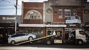 A car being towed from a clearway zone on Sydney Road in Brunswick in 2024.