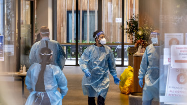 Workers in protective gear at an aged care facility in Melbourne.