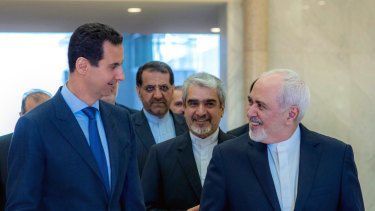 Syrian President Bashar al-Assad, left, speaking with Iranian Foreign Minister Mohammad Javad Zarif, right, in Damascus, Syria, last month.