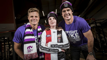 Nick Reiwoldt and Jonathon Brown with Maddie match ambassador Blake Driden, who suffers from aplasatic anemia.