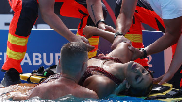 Anita Alvarez is pulled from the pool. 