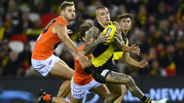 Dustin Martin tries to escape the attentions of Callan Ward.