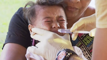 A child is vaccinated at a health clinic in Apia, Samoa, amid a measles outbreak in November.