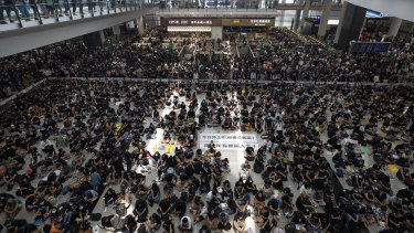 Protesters during a sit-in at the arrival hall of the Hong Kong International airport on Monday.