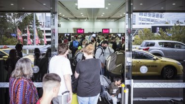 Large queues formed at Melbourne Airport’s terminal 3 departures on Tuesday.