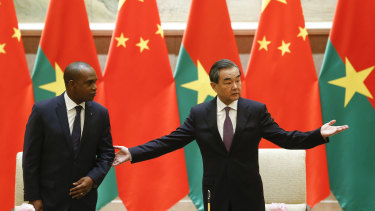 China's Foreign Minister Wang Yi (right) and Burkina Faso Foreign Minister Alpha Barry attend a signing ceremony establishing diplomatic relations in Beijing in May.