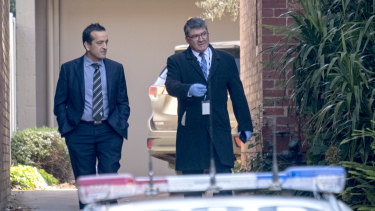 Homicide detectives outside Ms Price's Park Street property.