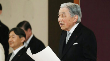 Japan's Emperor Akihito speaks during the ceremony of his abdication. His son and successor, Naruhito, is seen on the left.