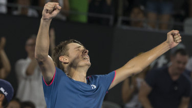 Smells like teen spirit: Alex de Minaur celebrates his breakthrough home victory.