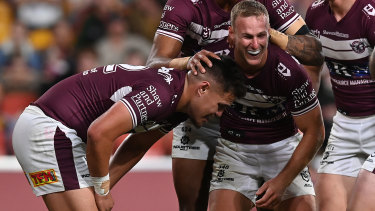 Josh Schuster and Daly Cherry-Evans celebrate another Sea Eagles try.