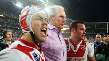 Jamie Soward with former coach Wayne Bennett and teammate Dean Young after the 2010 grand final victory against the Roosters.