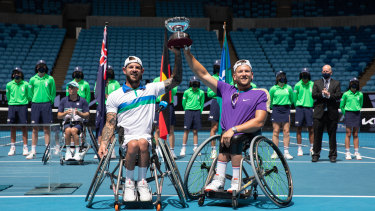 Heath Davidson and Dylan Alcott celebrate their 2021 quad wheelchair doubles final victory at the 2021 Australian Open. 