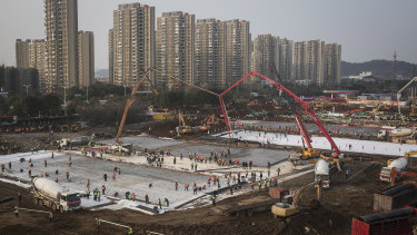 Hundreds of construction workers and heavy machinery build new hospitals to tackle the coronavirus on January 28, 2020 in Wuhan, China.
