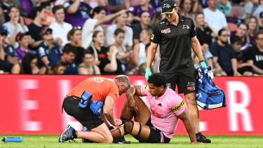 Tevita Pangai jnr gets attention for his injured knee last week.